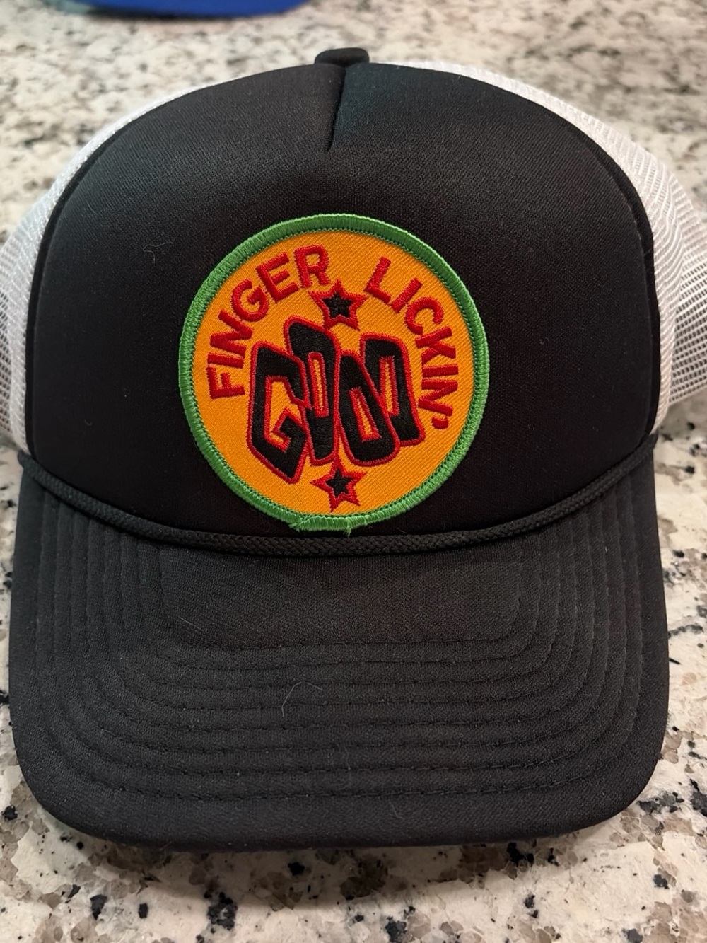Finger Lickin' Logo Trucker Hat - Black with Yellow Patch